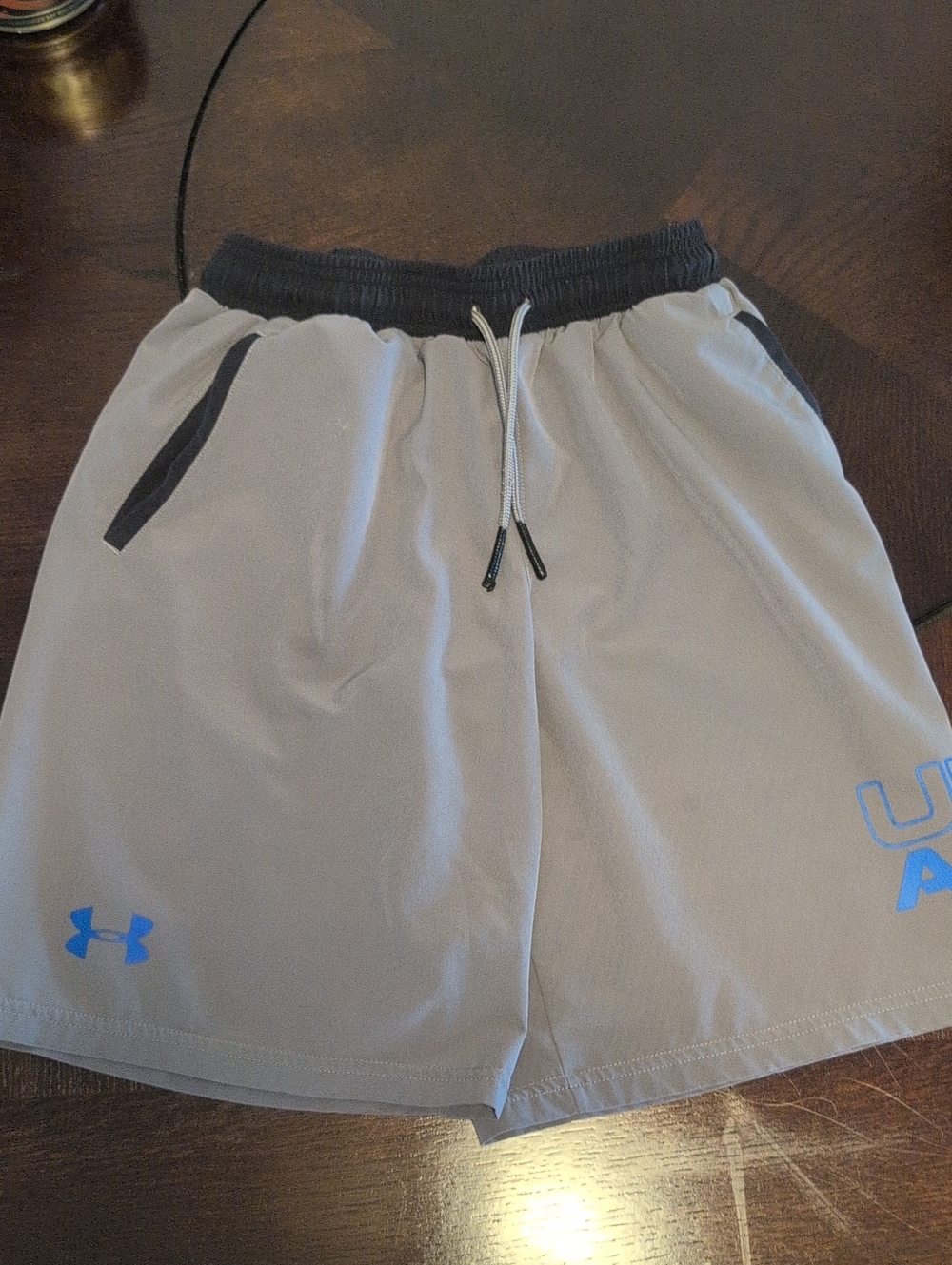 Under Armour Light Gray Athletic Shorts with Blue Logo Boy's Youth Small